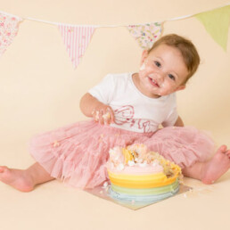 Celebrate-your-baby’s-first-birthday-with-a-joyful-cake-smash-and-splash-session.-Beautiful,-meaningful-portraits-in-Sussex-and-Kent
