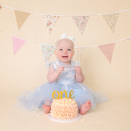 Celebrate-your-baby’s-first-birthday-with-a-joyful-cake-smash-and-splash-session.-Beautiful,-meaningful-portraits-in-Sussex-and-Kent