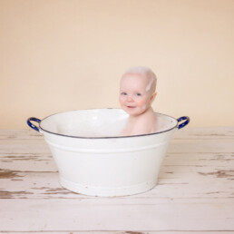 Celebrate-your-baby’s-first-birthday-with-a-joyful-cake-smash-and-splash-session.-Beautiful,-meaningful-portraits-in-Sussex-and-Kent