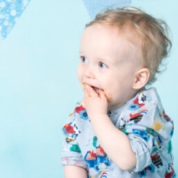 Celebrate-your-baby’s-first-birthday-with-a-joyful-cake-smash-and-splash-session.-Beautiful,-meaningful-portraits-in-Sussex-and-Kent