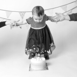 Celebrate-your-baby’s-first-birthday-with-a-joyful-cake-smash-and-splash-session.-Beautiful,-meaningful-portraits-in-Sussex-and-Kent