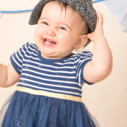 Celebrate-your-baby’s-first-birthday-with-a-joyful-cake-smash-and-splash-session.-Beautiful,-meaningful-portraits-in-Sussex-and-Kent