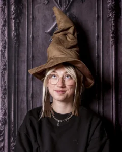 A child in wizard robes casting spells at immersive Wizard School photography experience in East Grinstead