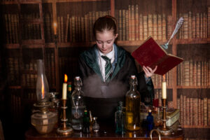 Child gently stepping into imagination during Wizard School experience