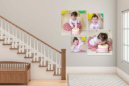 First birthday cake smash wall art showing a baby girl playing and laughing with her cake, displayed as a multi-frame gallery on a light, neutral staircase wall.