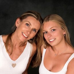 Mother and daughter studio portrait in East Grinstead before university, standing close and smiling naturally