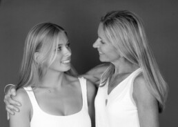 Mother and daughter studio portrait in East Grinstead before university, standing close and smiling naturally