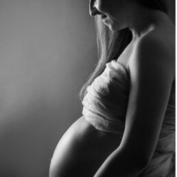 mother looking at her unborn child loving being pregnant