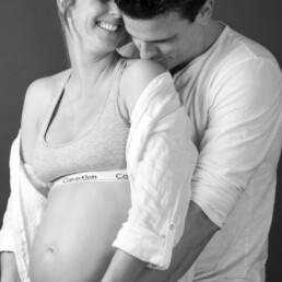 couple joyous and together at a maternity photo experience