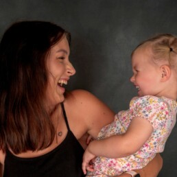 mother and baby daughter sharing laughter and closeness