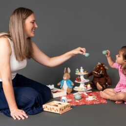 mother and daughter playing tea parties together