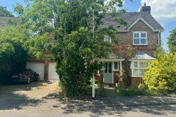 photograph of outside of woodland hill studio with parking on the drive