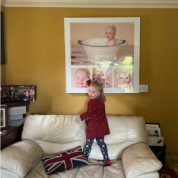 little girl looking at her artwork when she was a baby