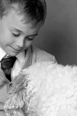 cockerpoo and his human brother share a close freindship